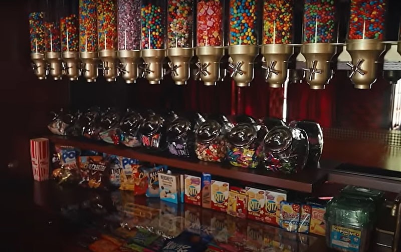 candy bar with many dispensers and jars full of colorful candy