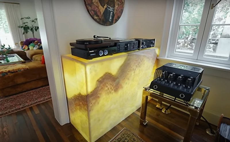 large Onyx box that lits up yellow, with record players sitting on top of it