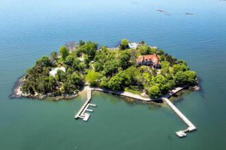 Aerial view of Rogers Island, off the coast of Branford, Connecticut, with the house and two docks in view