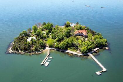 Aerial view of Rogers Island, off the coast of Branford, Connecticut, with the house and two docks in view