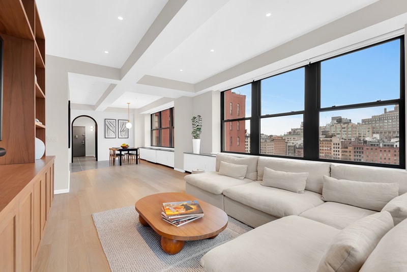 Sleek Tribeca apartment in Atalanta Condominium comes with a vibrant blue kitchen