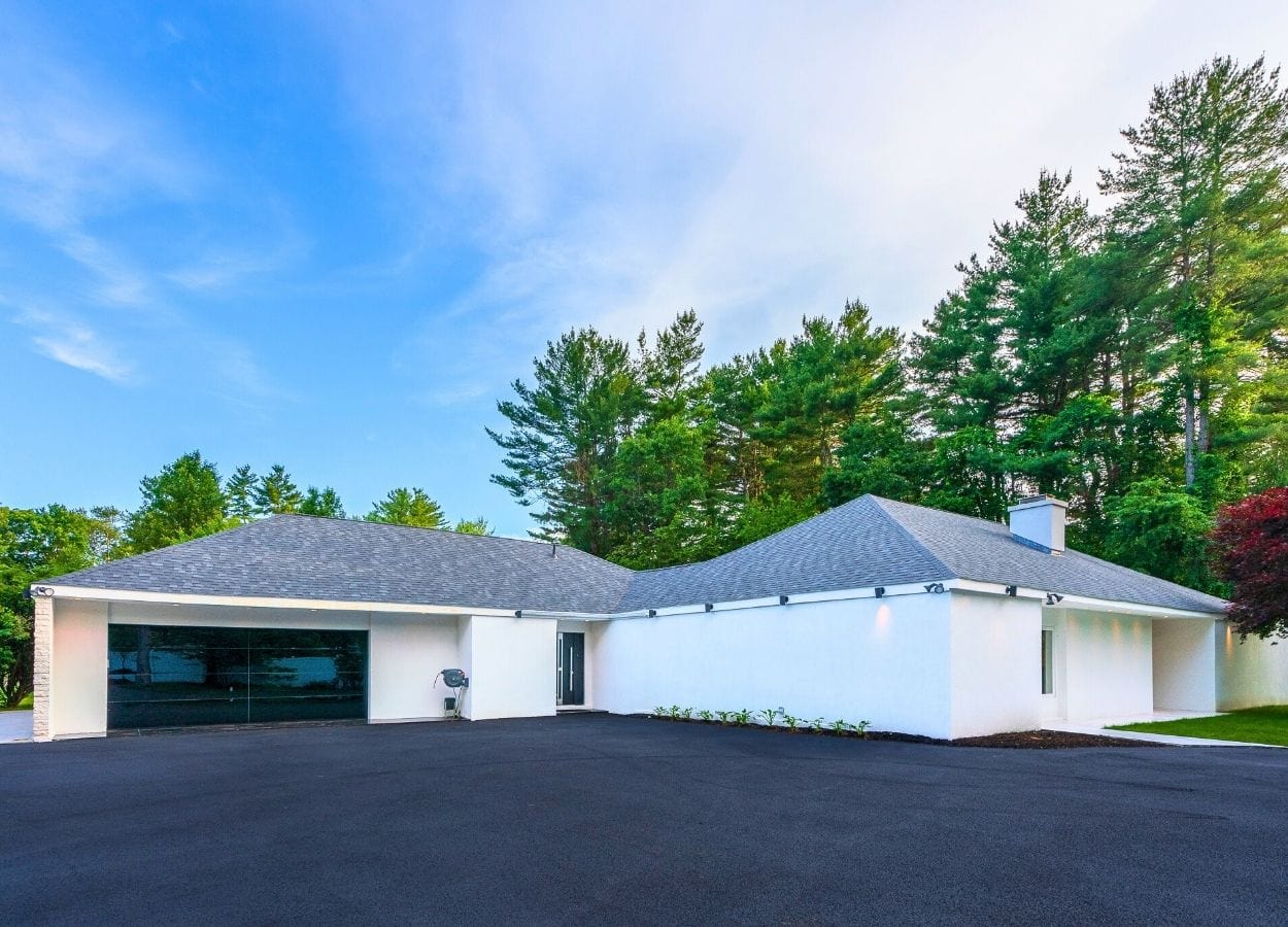 Unassuming outside, this $3.5M Easton home hides a central pool
